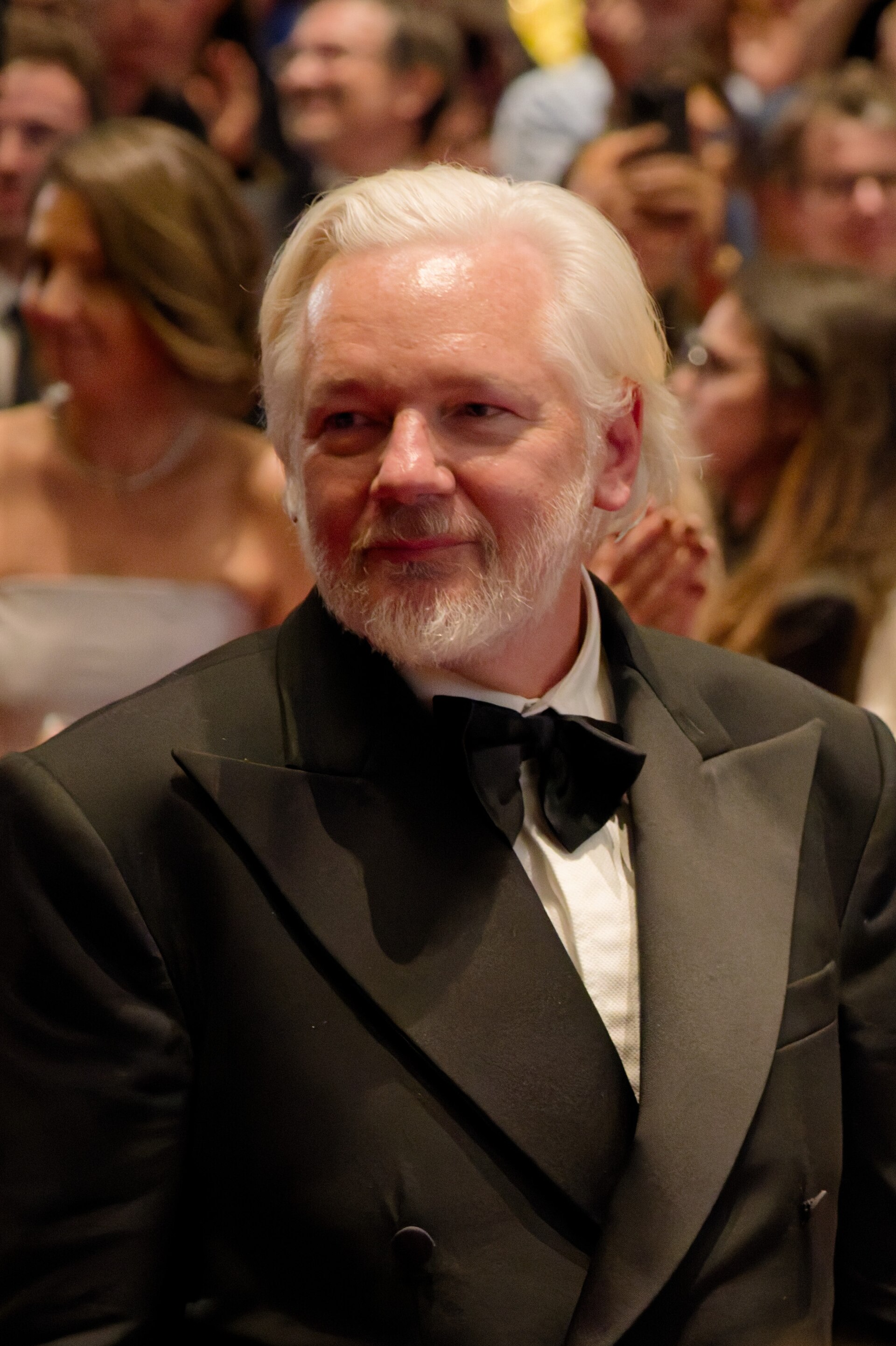 Julian Assange in the audience after the premiere of The Six Billion Dollar Man at the 2025 Cannes Film Festival
