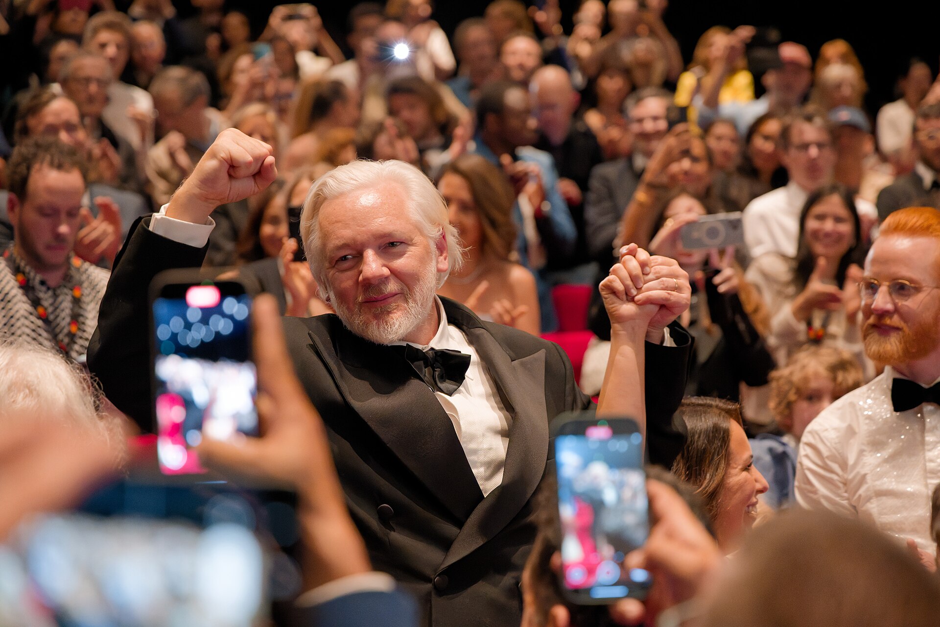 Julian Assange in the audience after the premiere of The Six Billion Dollar Man at the 2025 Cannes Film Festival