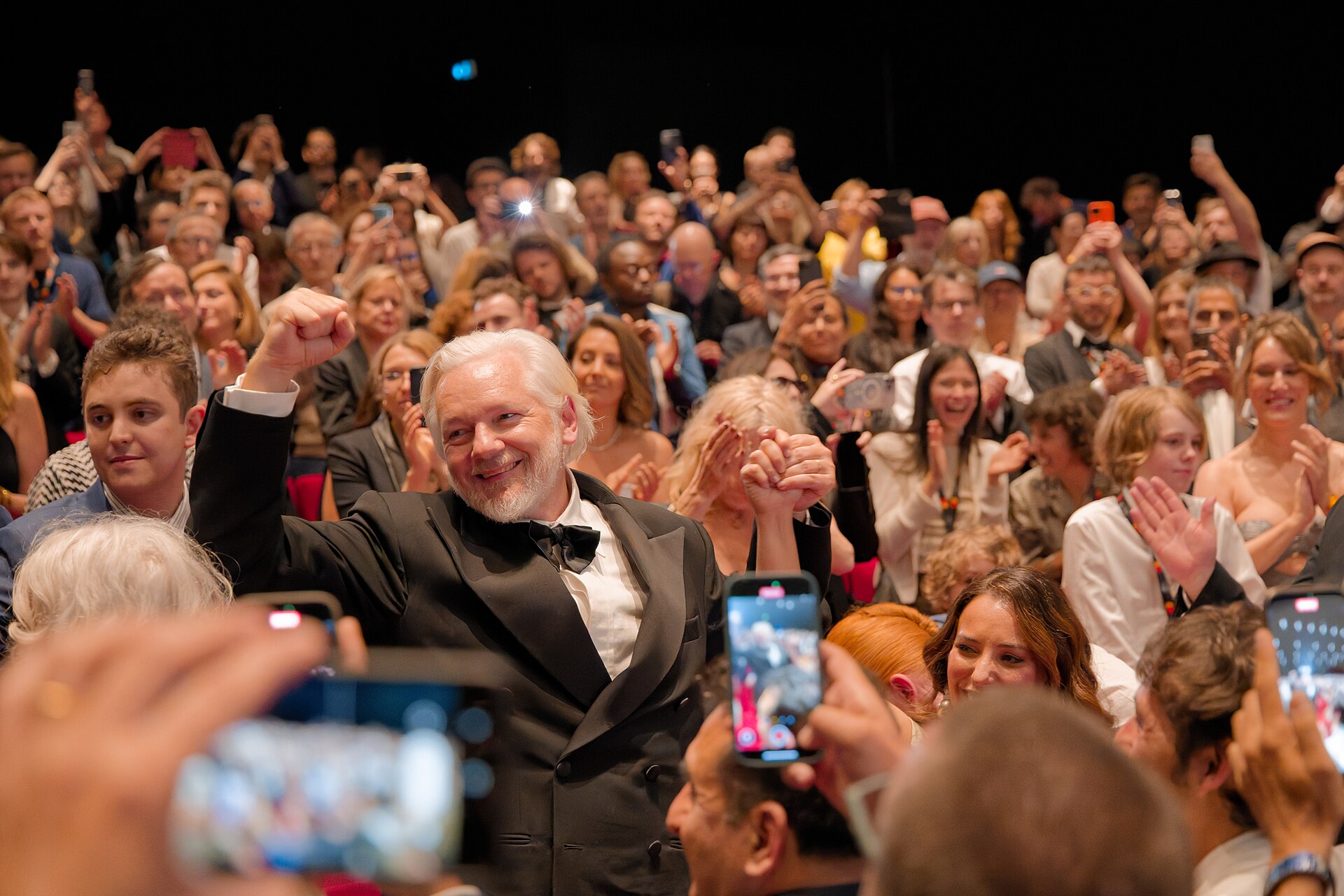 Julian Assange in the audience after the premiere of The Six Billion Dollar Man at the 2025 Cannes Film Festival