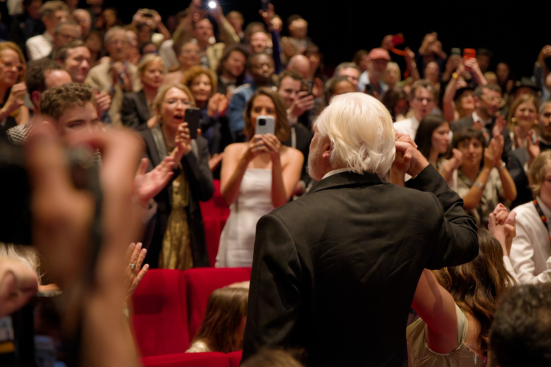 Julian Assange in the audience after the premiere of The Six Billion Dollar Man at the 2025 Cannes Film Festival