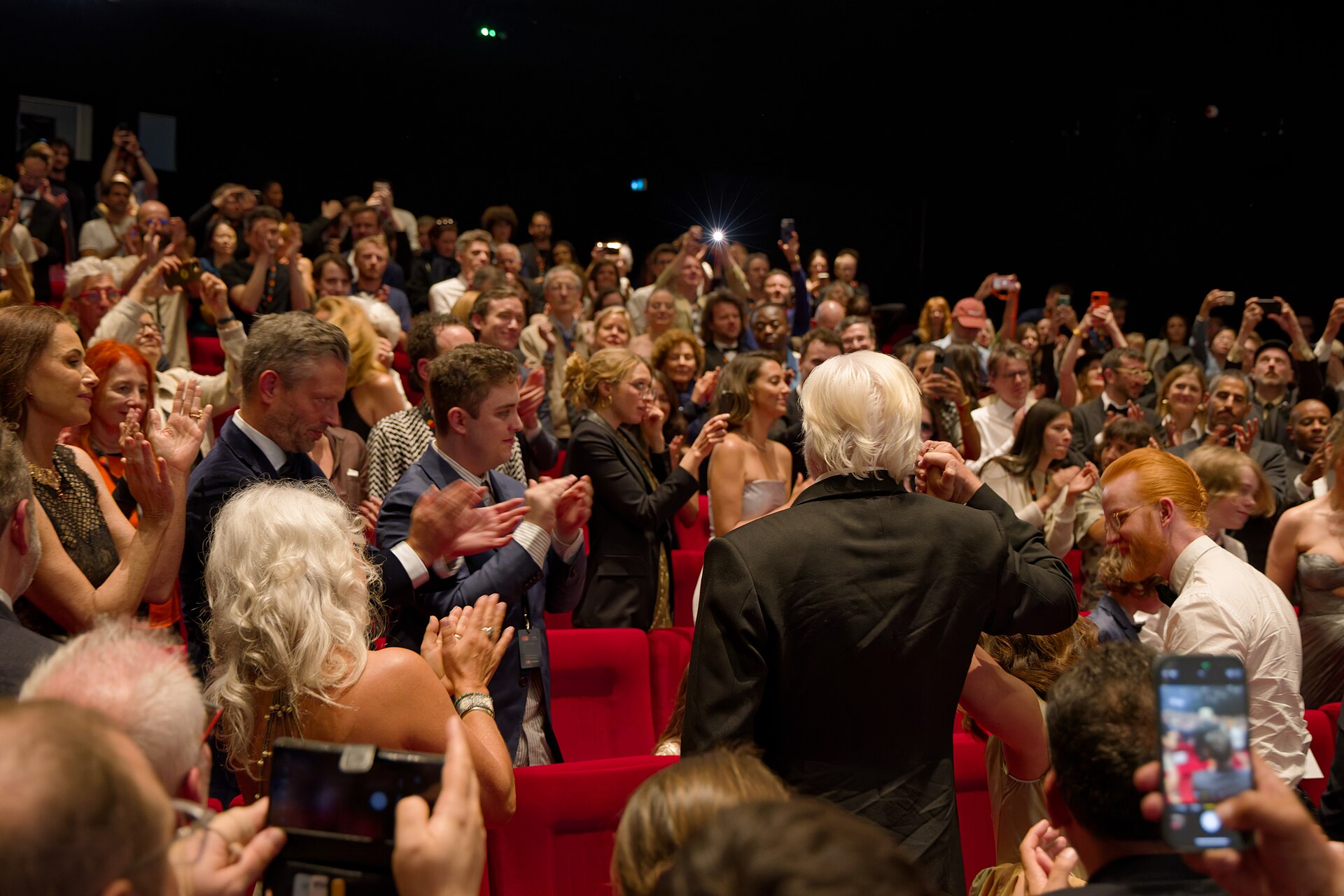 Julian Assange in the audience after the premiere of The Six Billion Dollar Man at the 2025 Cannes Film Festival
