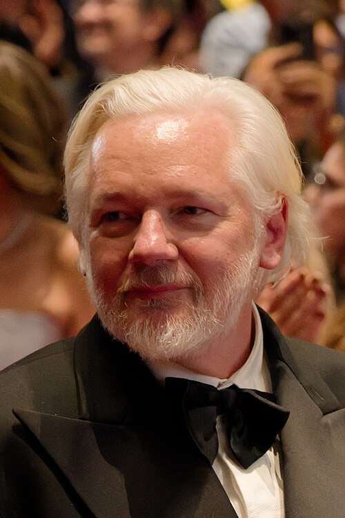 Julian Assange in the audience after the premiere of The Six Billion Dollar Man at the 2025 Cannes Film Festival