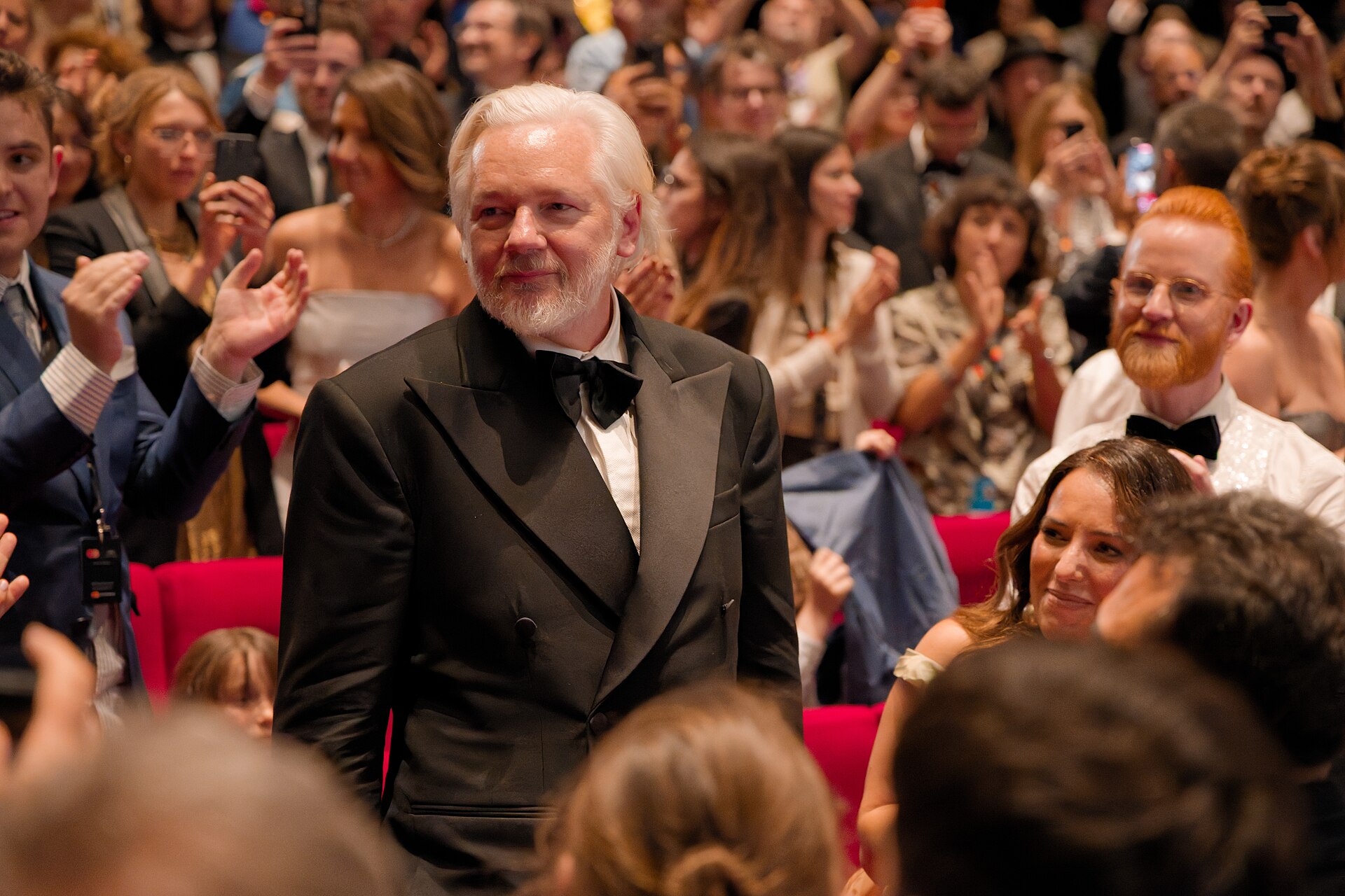 Julian Assange in the audience after the premiere of The Six Billion Dollar Man at the 2025 Cannes Film Festival