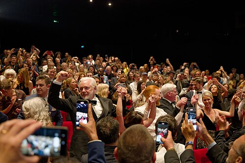 Julian Assange in the audience after the premiere of The Six Billion Dollar Man at the 2025 Cannes Film Festival