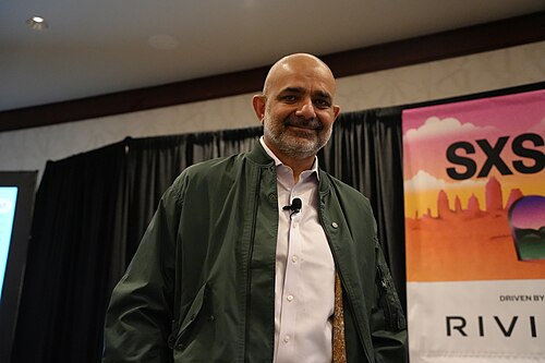 Karim Lakhani, Digital Data Design Institute at Harvard Business School, panel at SXSW 2025 in Austin, Texas. Our AI-Driven World: A Utopian Dream or Dystopian Nightmare?.