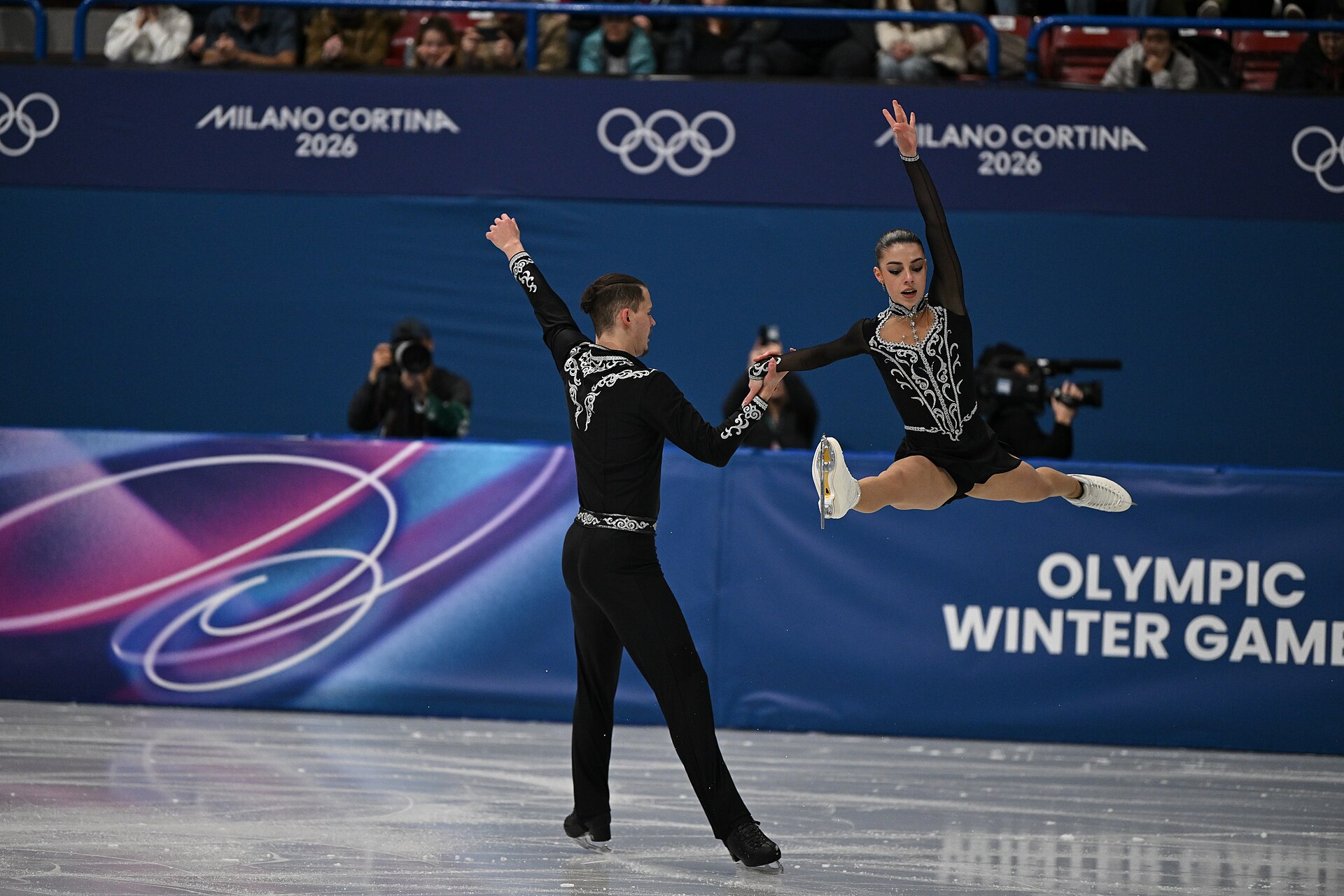 MILAN, ITALY - 15 FEBRUARY 2026: Karina Akopova and Nikita Rakhmanin of Armenia compete during the Figure Skating Pair Skating Short Program at the Olympic Winter Games Milano Cortina 2026  Milano Ice Skating Arena on February 15, 2026 in Milan, Italy