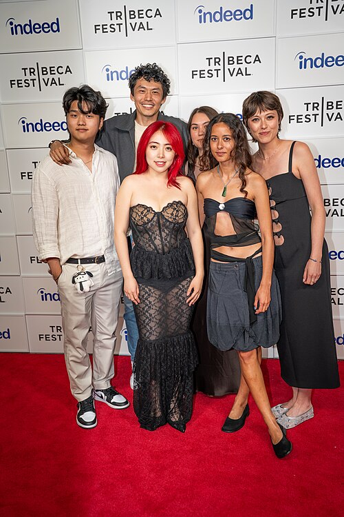 Kevin Jin Kwan Kim, Frank Sun, Jiayi Li, Olivia Owyeung, Ira Hetaraka, and Chelsie Pennello at a 2025 Tribeca Film Festival red carpet in New York City for the Floating Roots Shorts Program.
