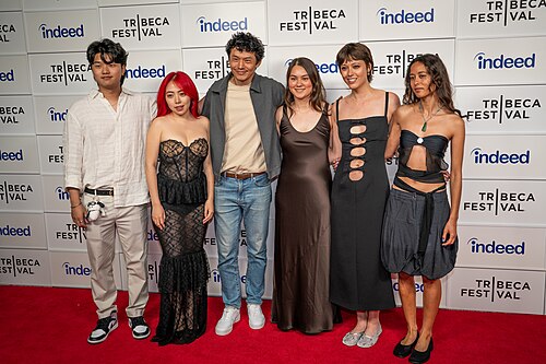 Kevin Jin Kwan Kim, Jiayi Li, Frank Sun, Olivia Owyeung, Chelsea Pennello, and Ira Hetaraka at a 2025 Tribeca Film Festival red carpet in New York City for the film Floating Roots Shorts Program.