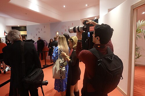 Kevin Payravi taking WikiPortraits photos after award press conferences at 2025 Cannes Film Festival