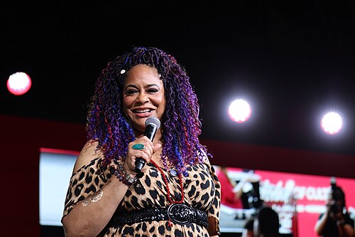 Kim Coles smiles on the main stage during a Q&A at Essence Fest 2025