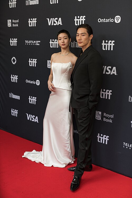 Kim Go-eun and Steve Sanghyun Noh at the 2024 Toronto International Film Festival red carpet for the film 'Love in the Big City'