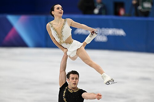MILAN, ITALY - 16 FEBRUARY 2026: Lia PEREIRA and Trennt MICHAUD of Canada compete during the Figure Skating Pair Skating Free Skating at the Olympic Winter Games Milano Cortina 2026 Milano Ice Skating Arena on February 16, 2026 in Milan, Italy