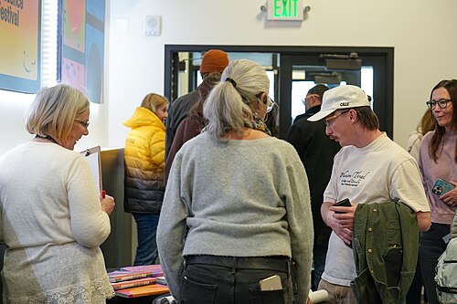 Lisa Rajigah handing out raffle prizes to audience members at Sundance Film Festival 2026