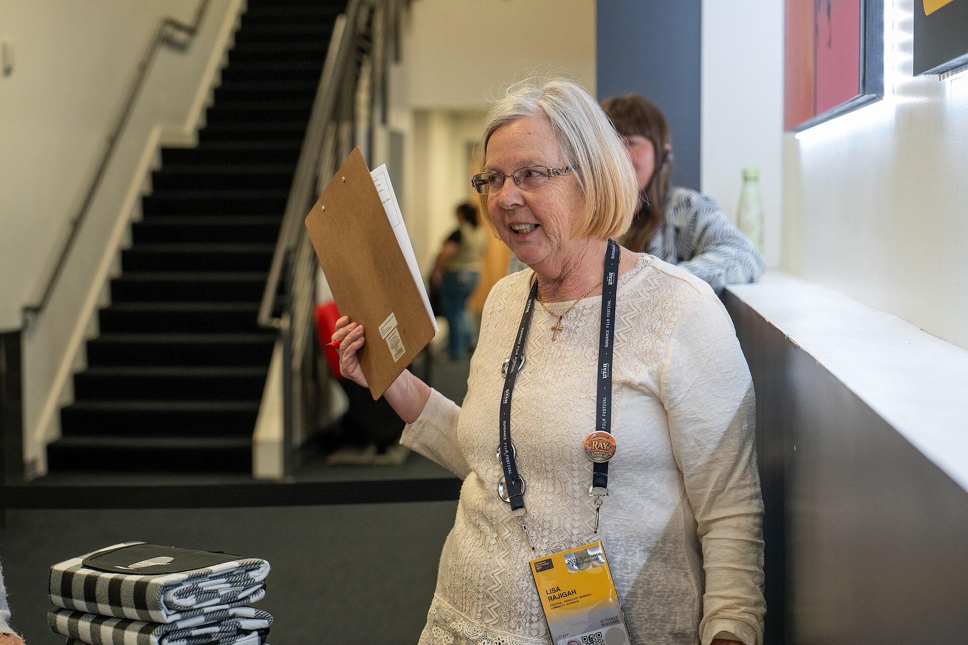 Lisa Rajigah handing out raffle prizes to audience members at Sundance Film Festival 2026