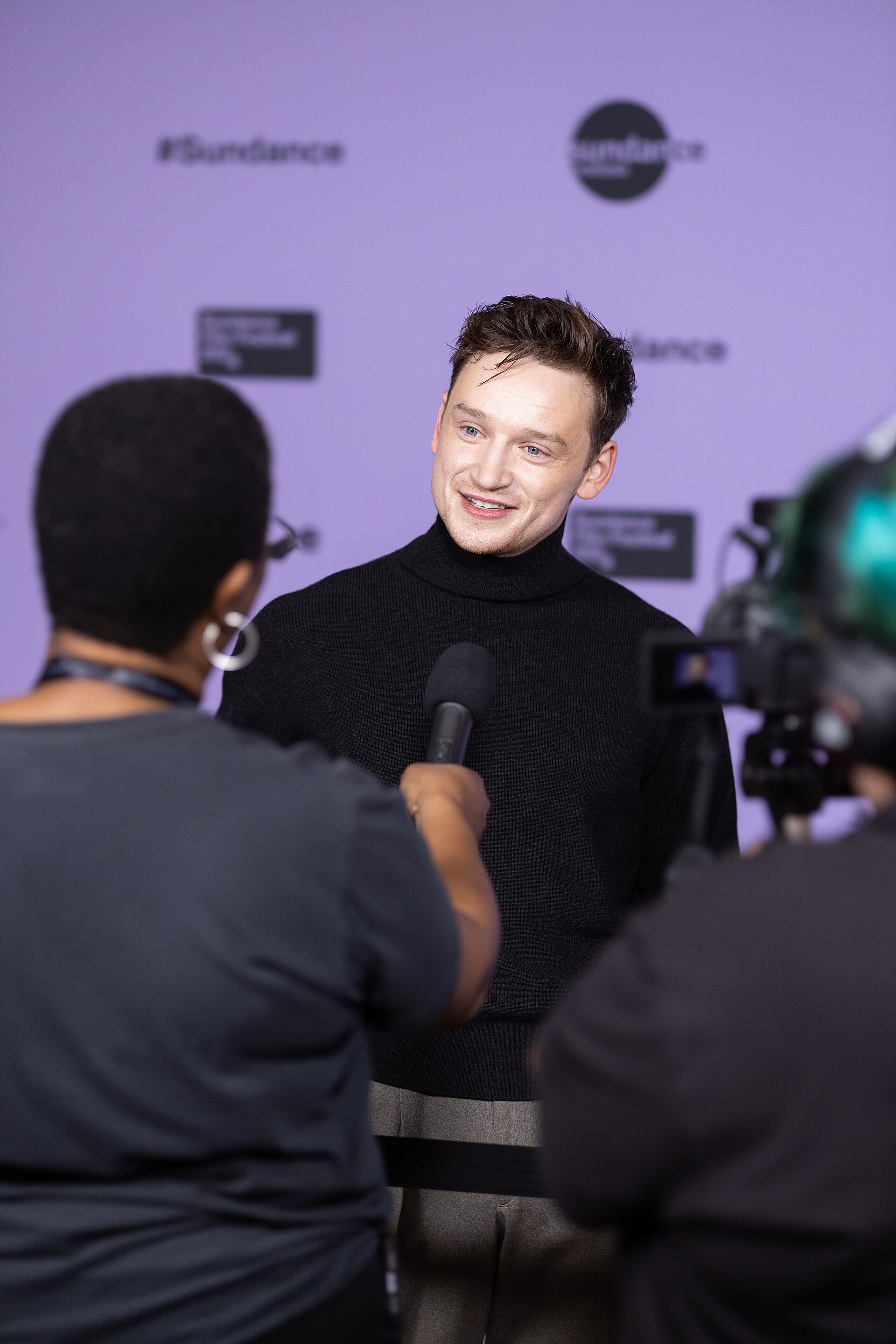 Louis Greatorex being interviewed by journalists at the 2024 Sundance Film Festival on January 18, 2024.