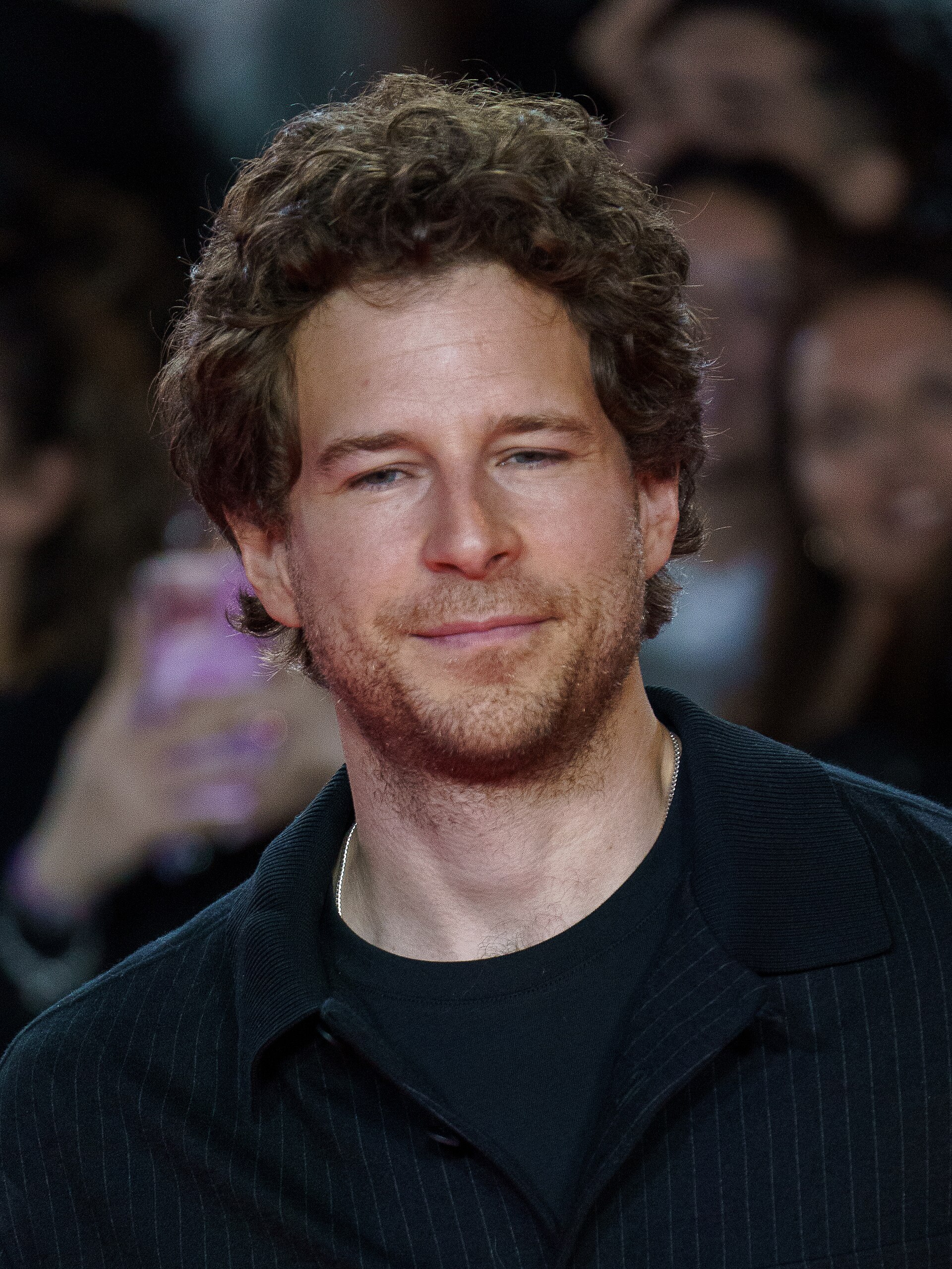 Álvaro Cervantes at the Red Carpet of the Malaga 2025 Festival next to Cervantes Theater