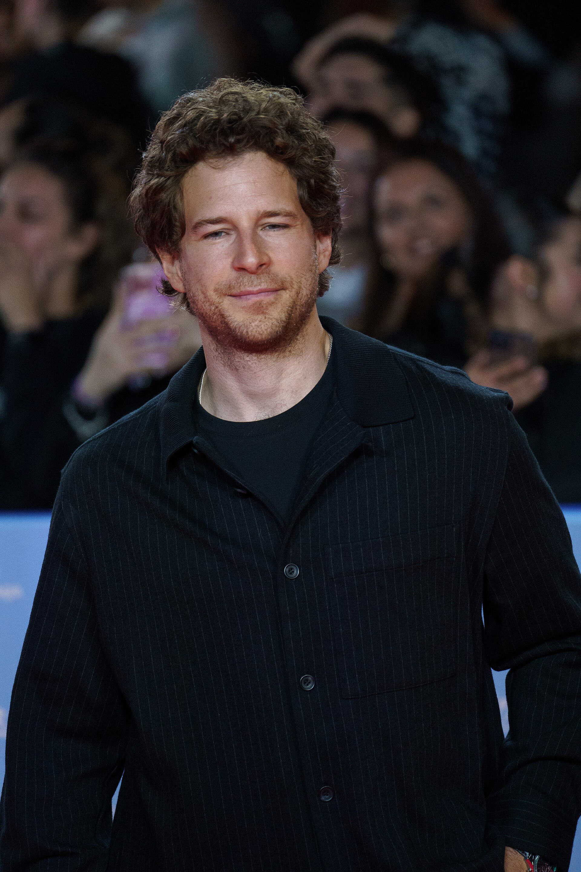 Álvaro Cervantes at the Red Carpet of the Malaga 2025 Festival next to Cervantes Theater
