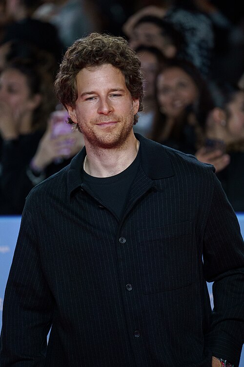 Álvaro Cervantes at the Red Carpet of the Malaga 2025 Festival next to Cervantes Theater
