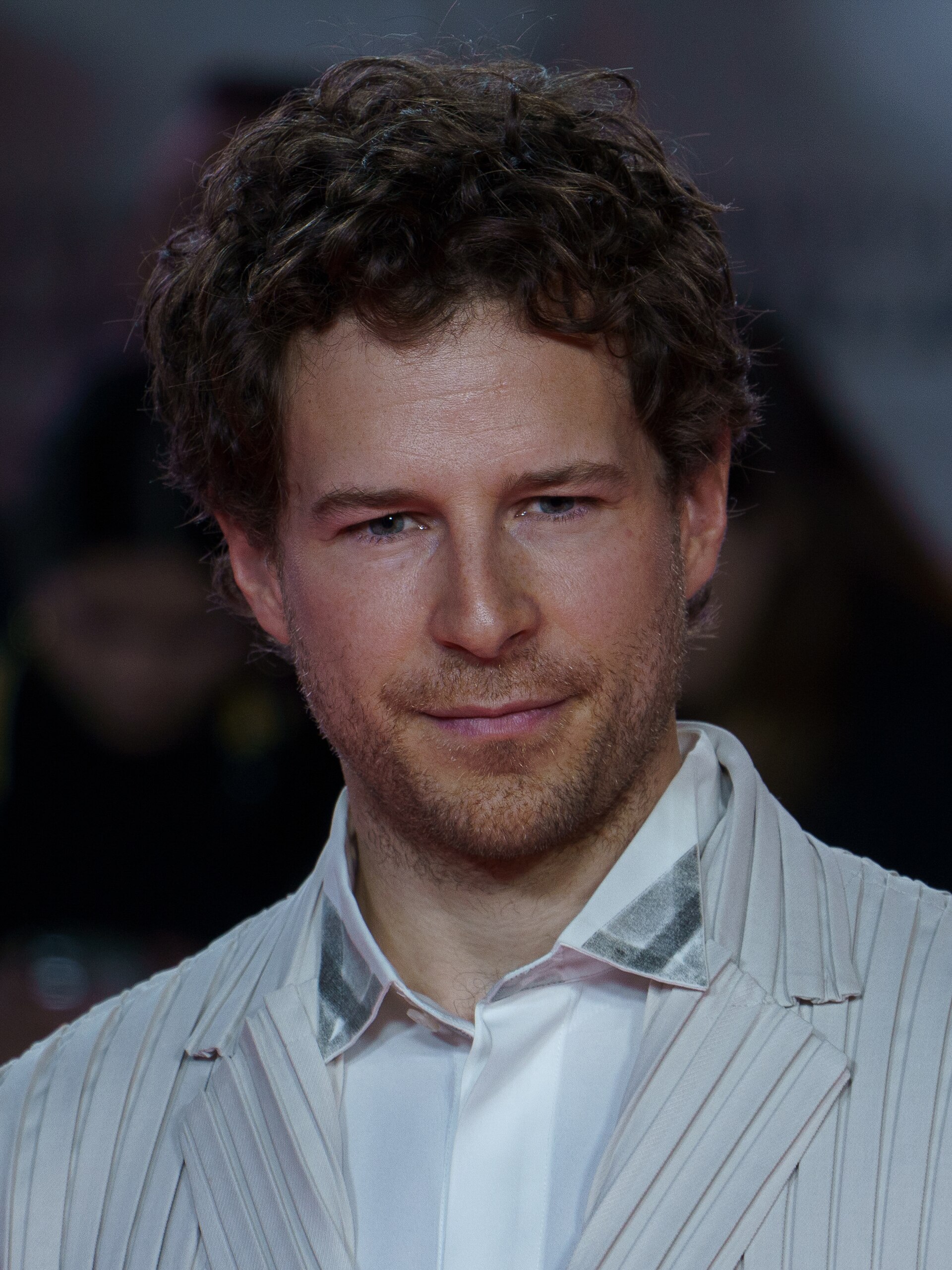 Álvaro Cervantes at the Red Carpet of the Malaga 2025 Festival next to Cervantes Theater