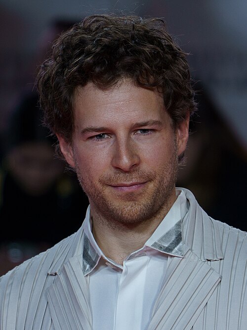 Álvaro Cervantes at the Red Carpet of the Malaga 2025 Festival next to Cervantes Theater