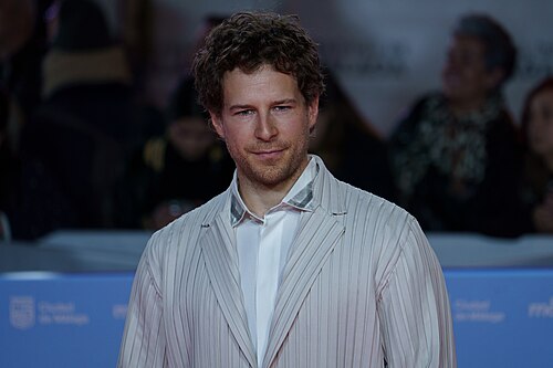Álvaro Cervantes at the Red Carpet of the Malaga 2025 Festival next to Cervantes Theater