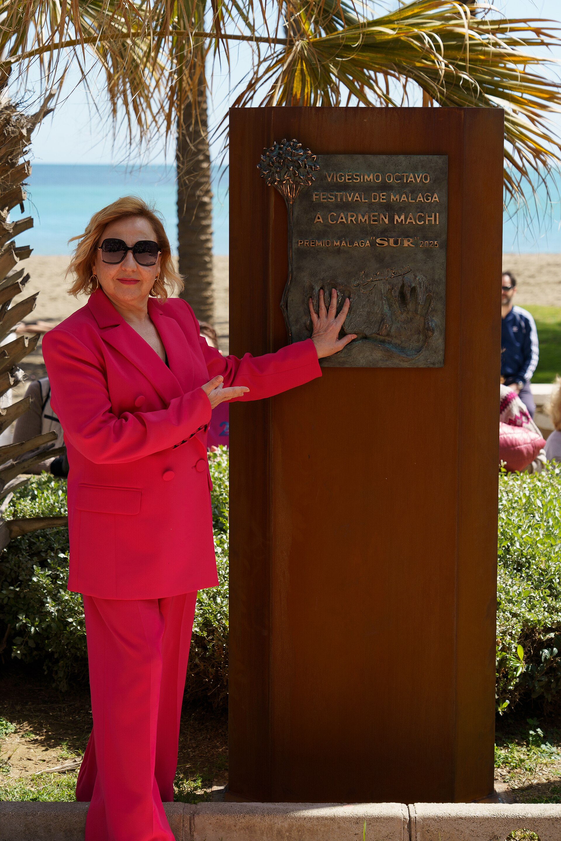 Carmen Machi unveiling the plaque in his honor at the Paseo Marítimo Antonio Banderas during Malaga Film Festival 2025