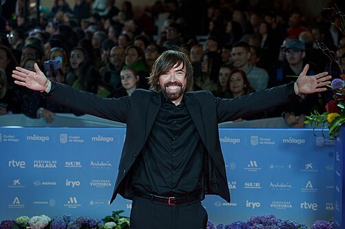 David Valero at the Red Carpet of the Malaga 2025 Festival next to Cervantes Theater