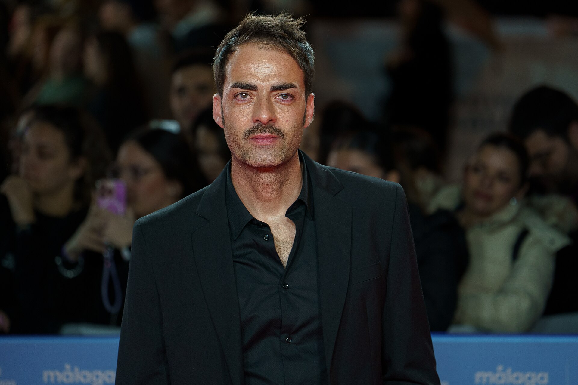 Manuel Minaya at Red Carpet of the Malaga 2025 Festival next to Cervantes Theater