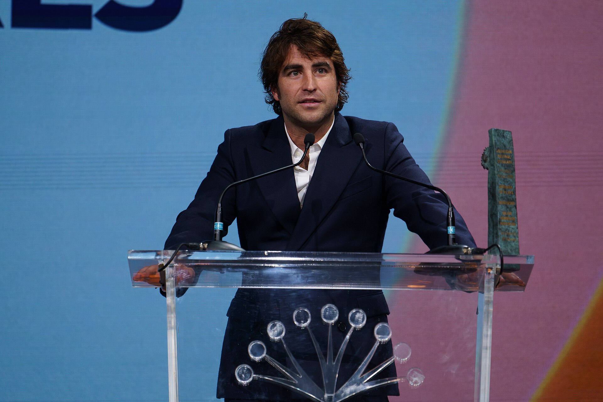 Marco Cáceres at the stage of Cervantes Theatre with the Prize Málaga Cinema