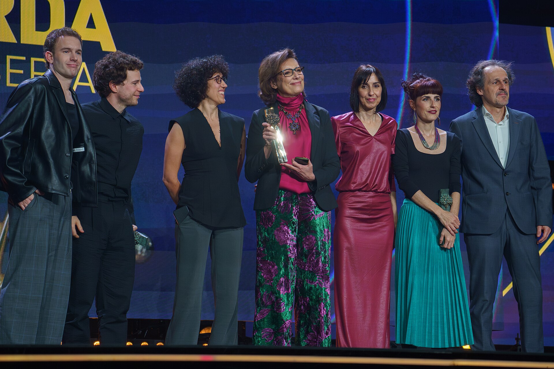 The crew of the film Sorda collecting several awards on stage at the Cervantes Theater