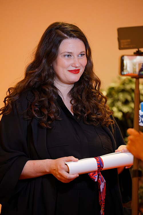 Mascha Schilinski being interviewed by press after winning an award at the 2025 Cannes Film Festival.