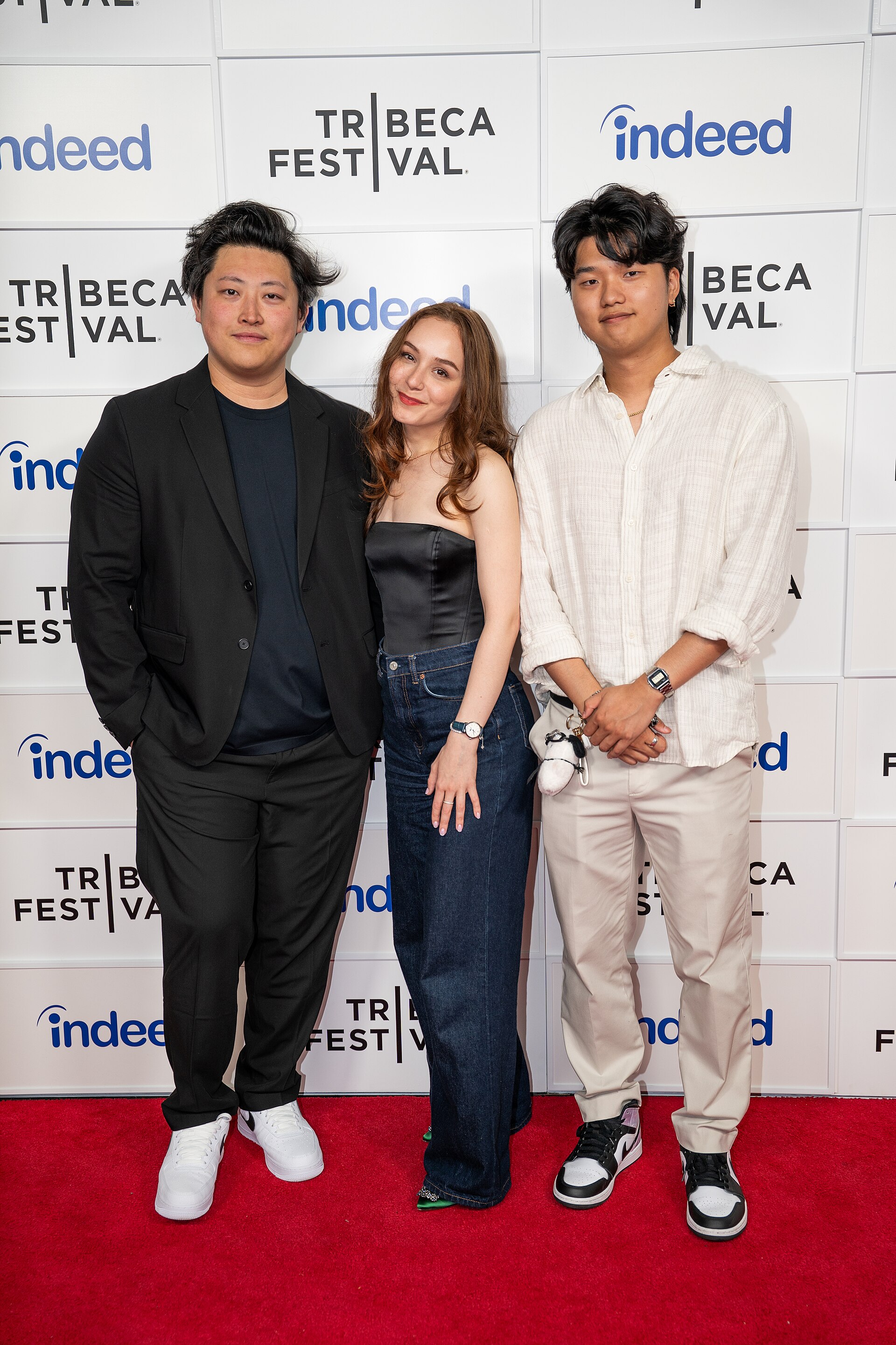 Michael Ren, Anastasia Itkina, and Kevin Jin Kwan Kim, , at a 2025 Tribeca Film Festival red carpet in New York City for the film My Dad, the Rockstar.