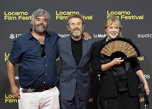 Director Miguel Ángel Jiménez, actor Willem Dafoe and actress Emma Suárez at 78th Locarno Film Festival red carpet for The Birthday Party