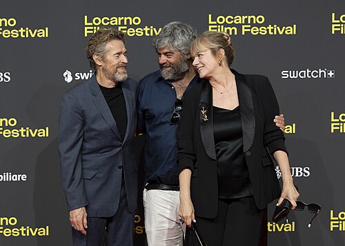 Director Miguel Ángel Jiménez, actor Willem Dafoe and actress Emma Suárez at 78th Locarno Film Festival red carpet for The Birthday Party