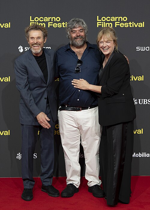 Director Miguel Ángel Jiménez, actor Willem Dafoe and actress Emma Suárez at 78th Locarno Film Festival red carpet for The Birthday Party