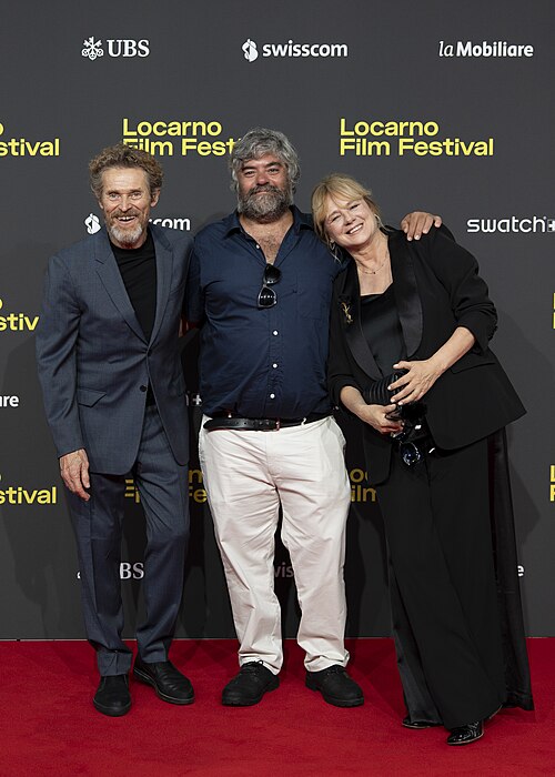 Director Miguel Ángel Jiménez, actor Willem Dafoe and actress Emma Suárez at 78th Locarno Film Festival red carpet for The Birthday Party