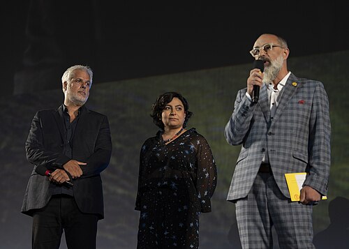 Director Miguel Ángel Jiménez, actor Willem Dafoe and actress Emma Suárez at 78th Locarno Film Festival red carpet for The Birthday Party