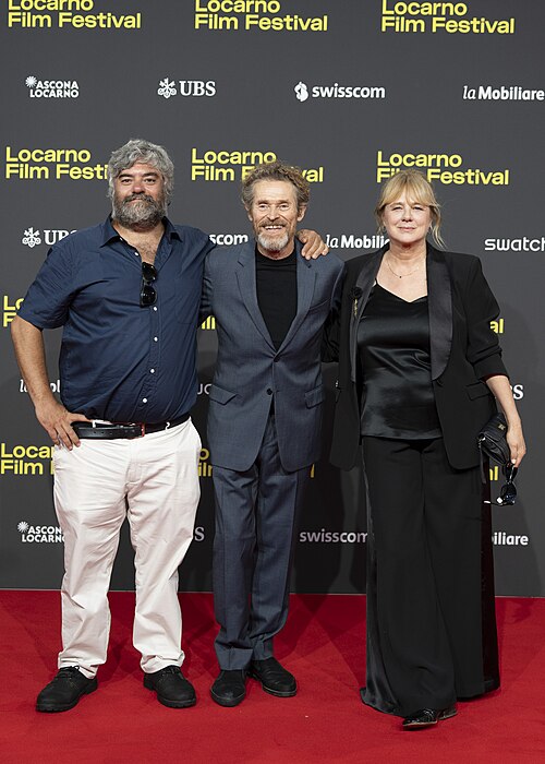 Director Miguel Ángel Jiménez, actor Willem Dafoe and actress Emma Suárez at 78th Locarno Film Festival red carpet for The Birthday Party
