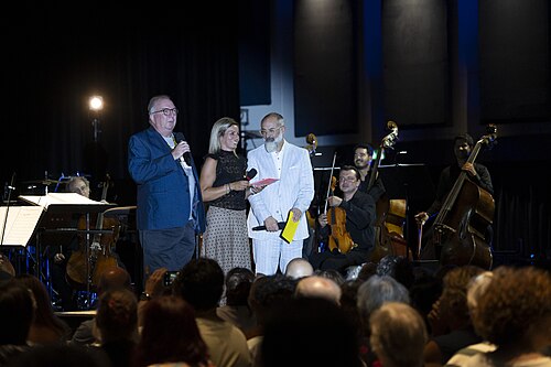 Neil Brand and Giona A. Nazzaro introducing the Opening Concert of the 78th Locarno Film Festival with live music performed by the Orchestra della Svizzera italiana.