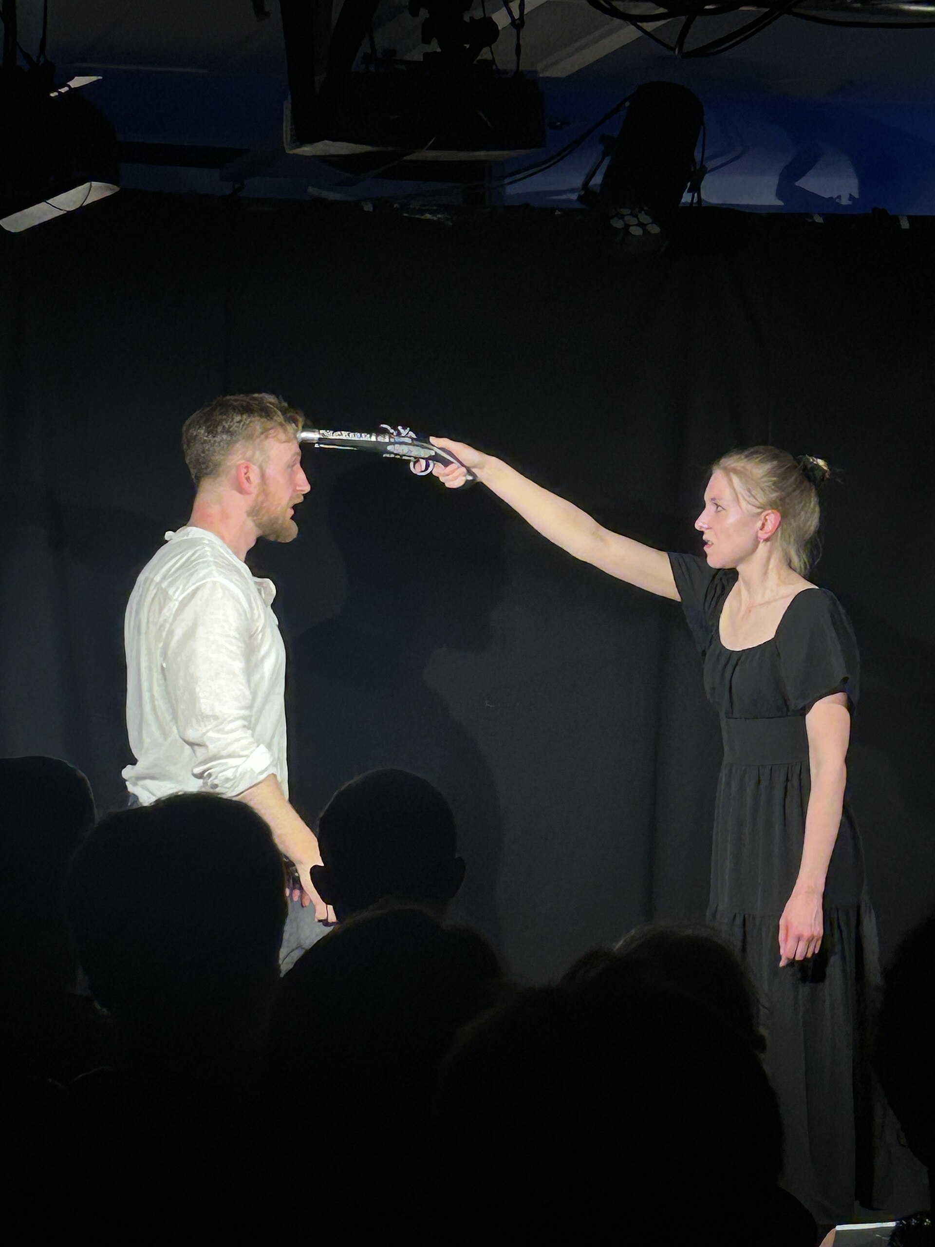 Nic Caws Dylan McCullagh in The Bear at Edinburgh Fringe 2025 with gun