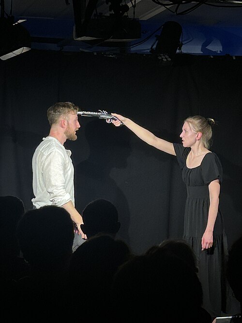 Nic Caws Dylan McCullagh in The Bear at Edinburgh Fringe 2025 with gun