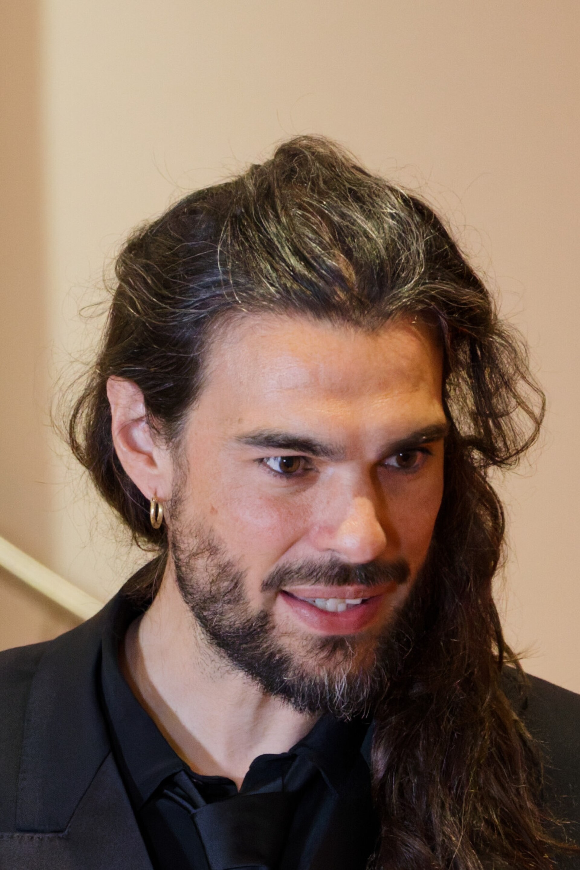 Oliver Laxe being interviewed by press after winning an award at the 2025 Cannes Film Festival.