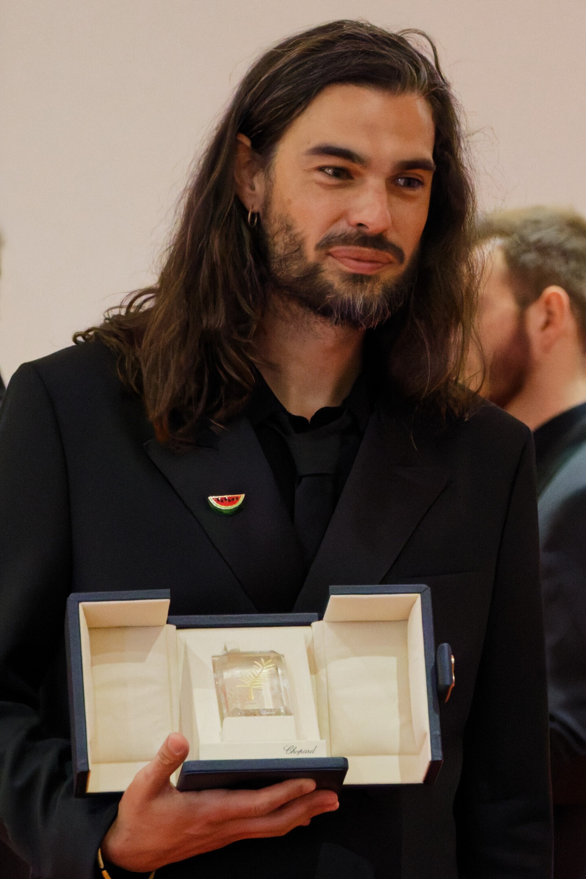Oliver Laxe being interviewed by press after winning an award at the 2025 Cannes Film Festival.