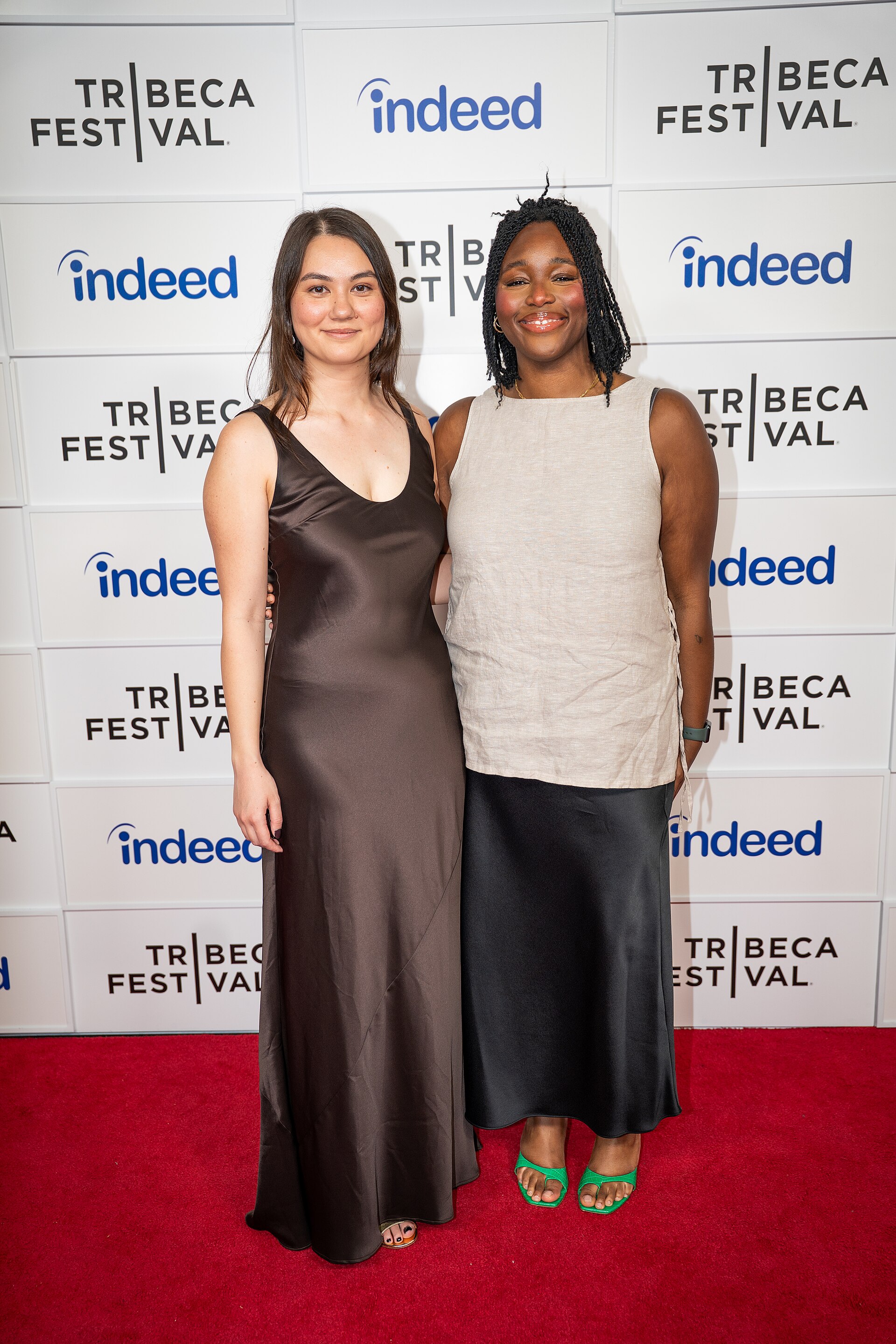 Olivia Owyeung and Toyosi Fuwa at a 2025 Tribeca Film Festival red carpet in New York City for the film Red Egg and Ginger Face.