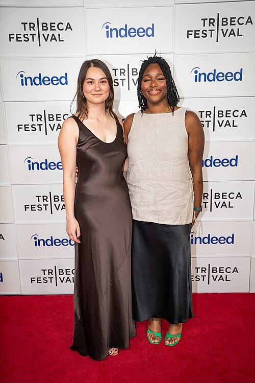 Olivia Owyeung and Toyosi Fuwa at a 2025 Tribeca Film Festival red carpet in New York City for the film Red Egg and Ginger Face.