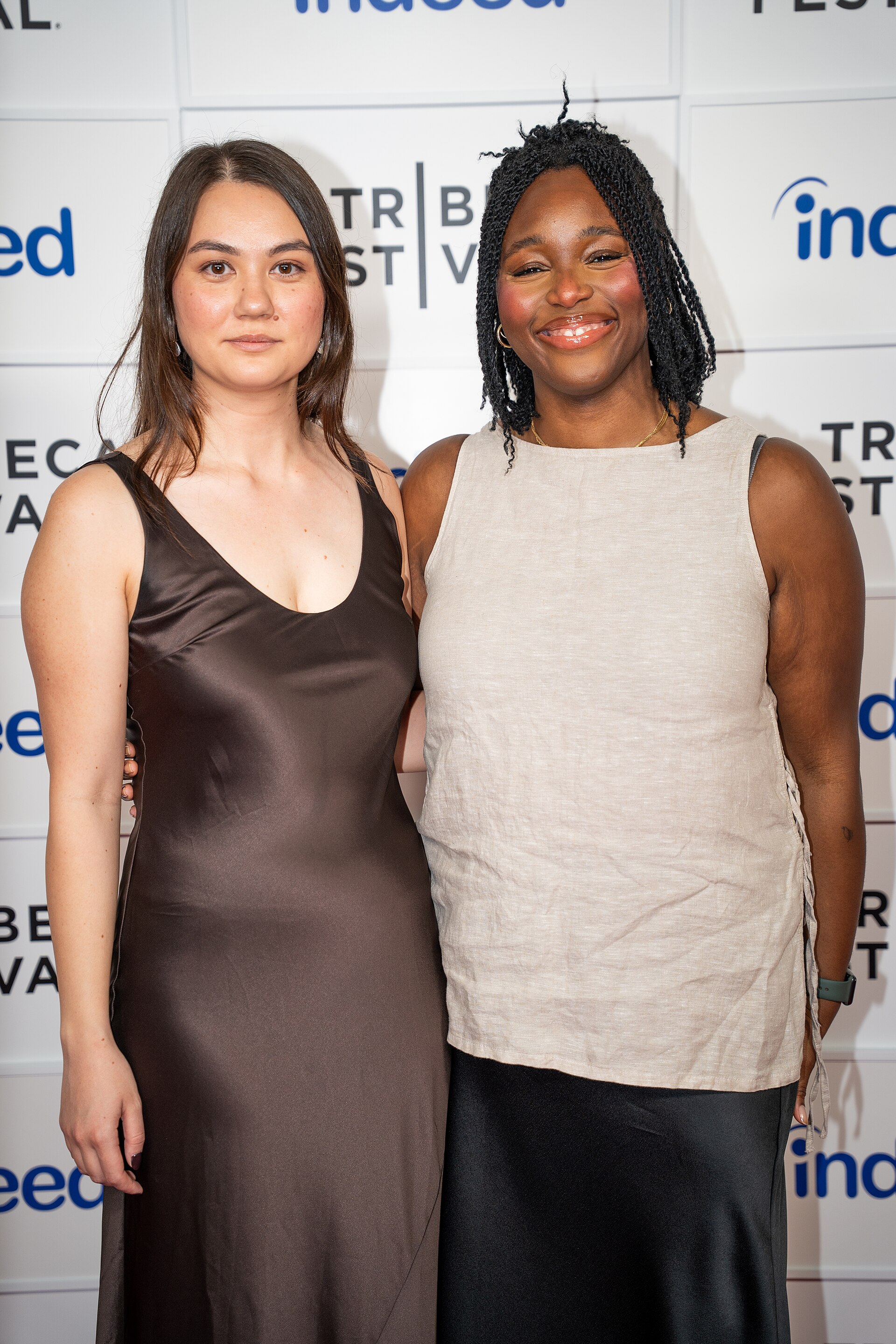 Olivia Owyeung and Toyosi Fuwa at a 2025 Tribeca Film Festival red carpet in New York City for the film Red Egg and Ginger Face.