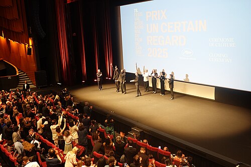 Tarzan Nasser and Arab Nasser, Palestinian film directors, accepting the Un Certain Regard directing award for Once Upon a Time in Gaza at 2025 Cannes Film Festival