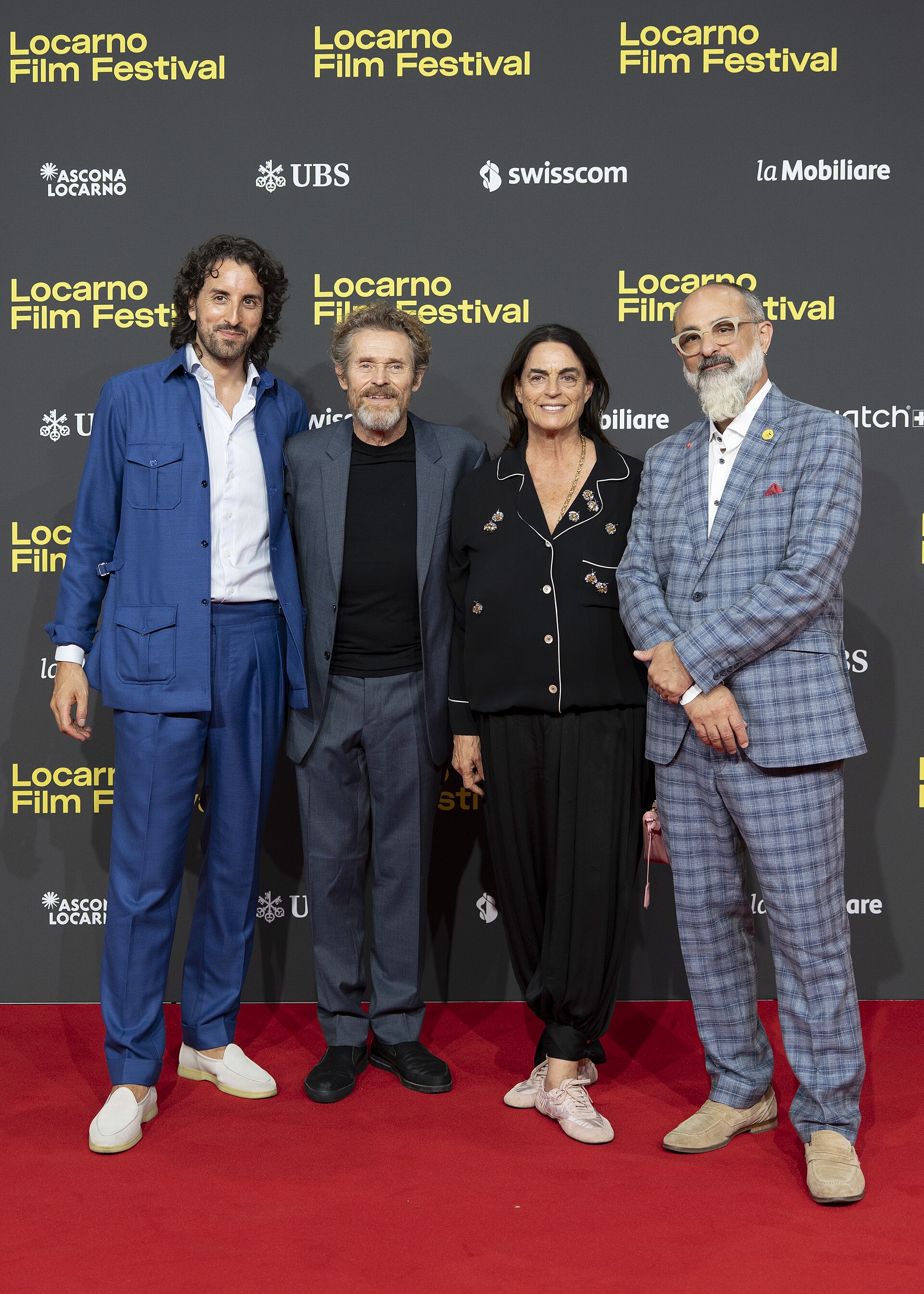 CEO Raphaël Brunschwig, actor Willem Dafoe, President Maja Hoffmann and Artistic director Giona A. Nazzaro at the 78th Locarno Film Festival red carpet