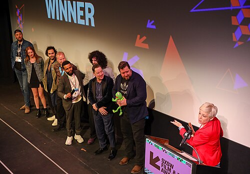 Cast and crew of Bob Trevino Likes It on stage at the SXSW 2024 Film Festival award ceremony that took place at the Paramount Theatre in Austin, Texas. The film, directed by Tracie Laymon, won the SXSW 2024 Narrative Feature Competition Award.
