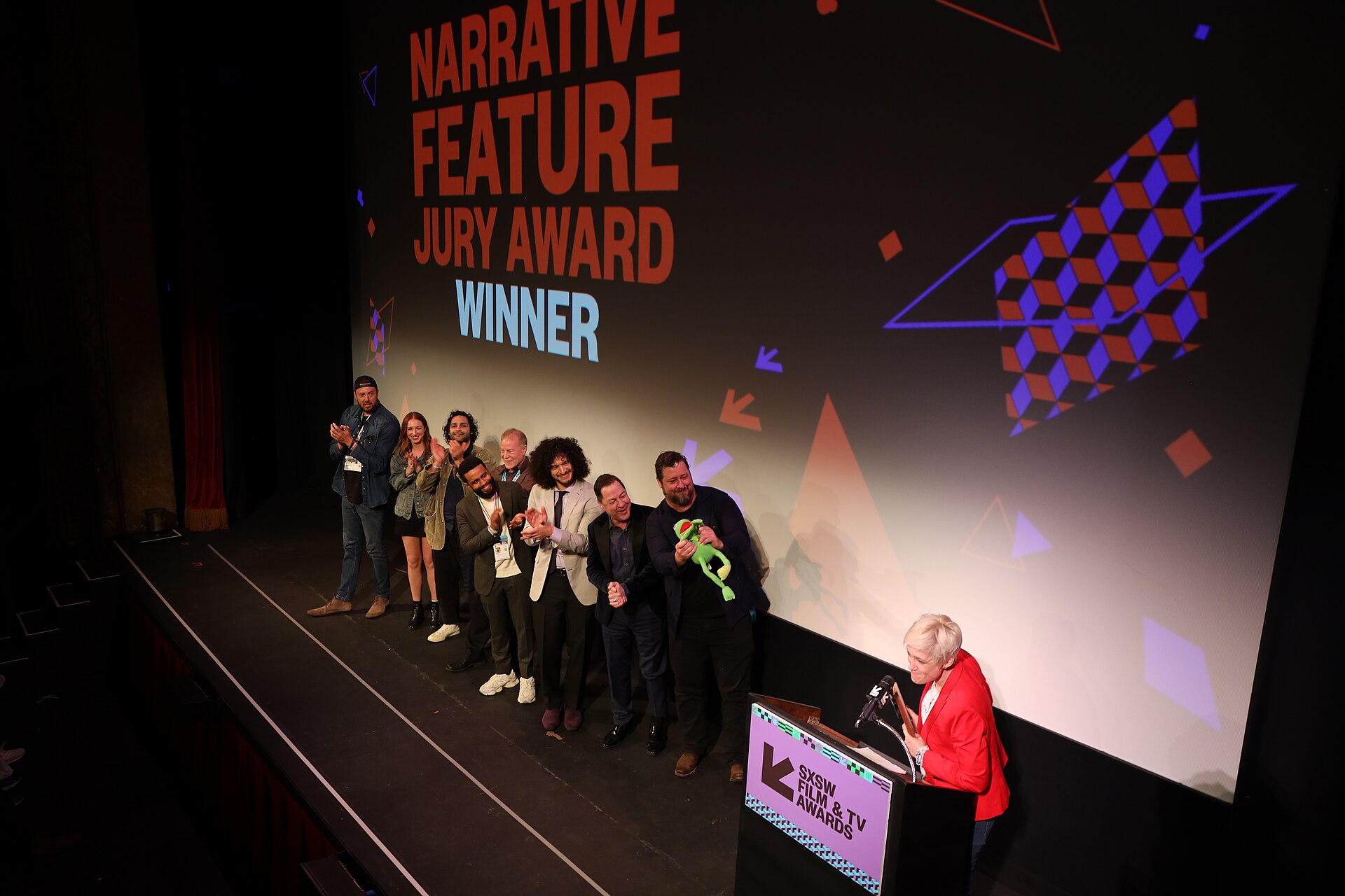 Cast and crew of Bob Trevino Likes It on stage at the SXSW 2024 Film Festival award ceremony that took place at the Paramount Theatre in Austin, Texas. The film, directed by Tracie Laymon, won the SXSW 2024 Narrative Feature Competition Award.